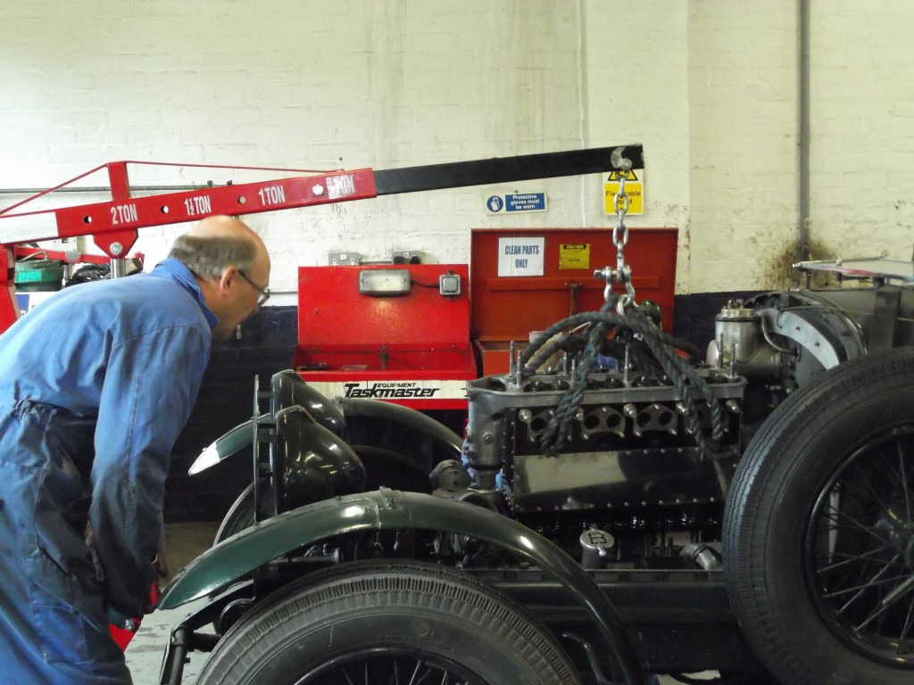 The 4 1/2 litre engine is fitted back into the car