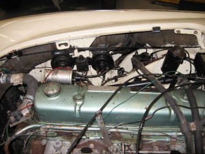 Engine bay showing poor wiring, etc